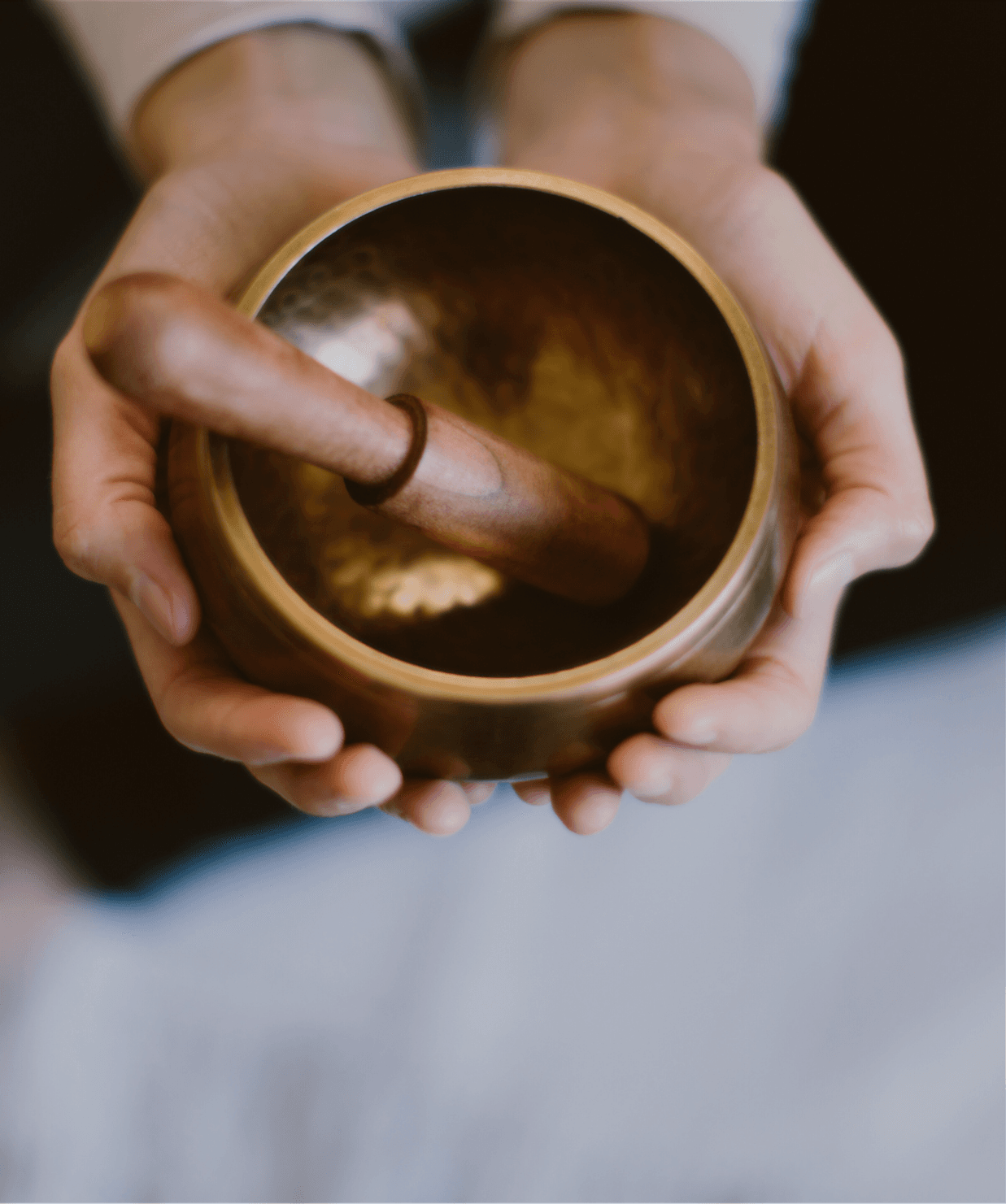 hands cupping mortar and pestle